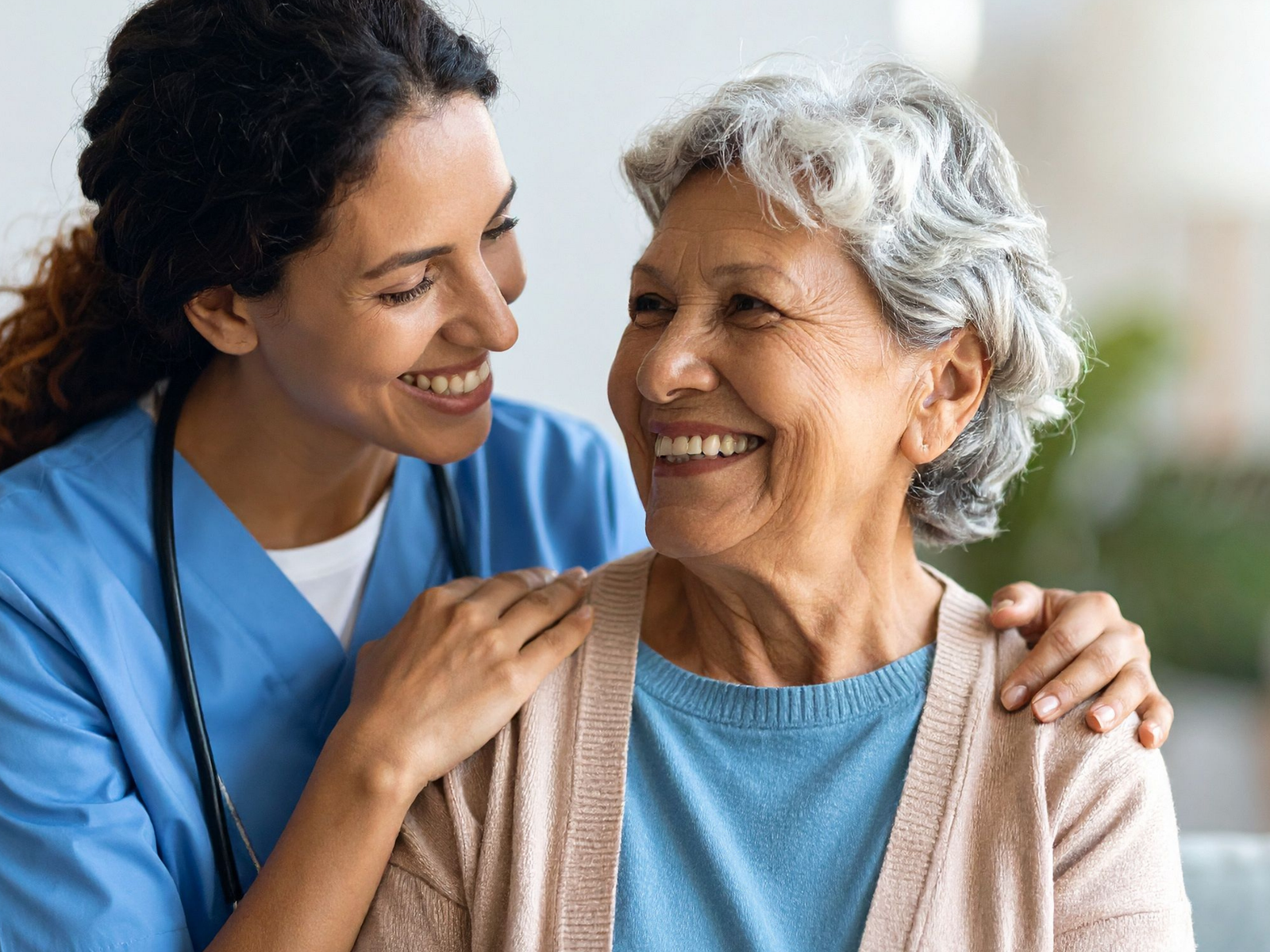 Caregiver assisting an older adult with daily routines at home