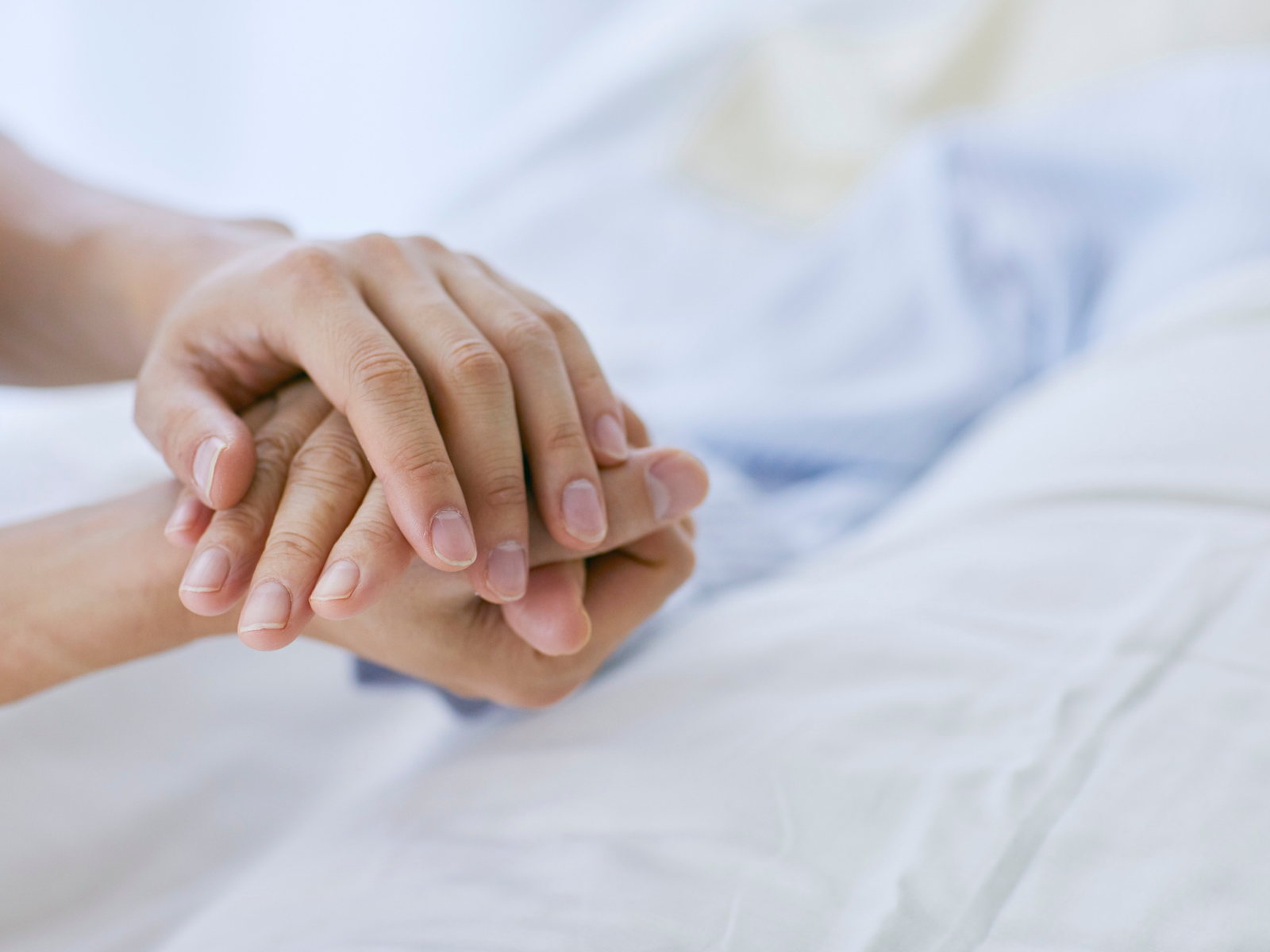 Caregiver helping with light housekeeping in a home kitchen