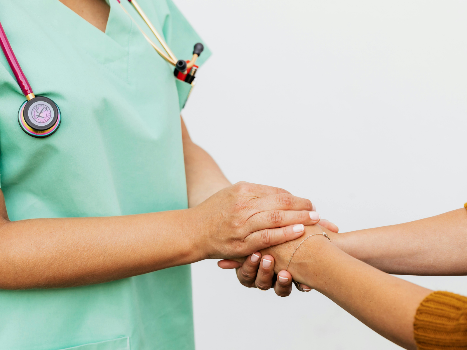 Caregiver speaking calmly with an older adult at home
