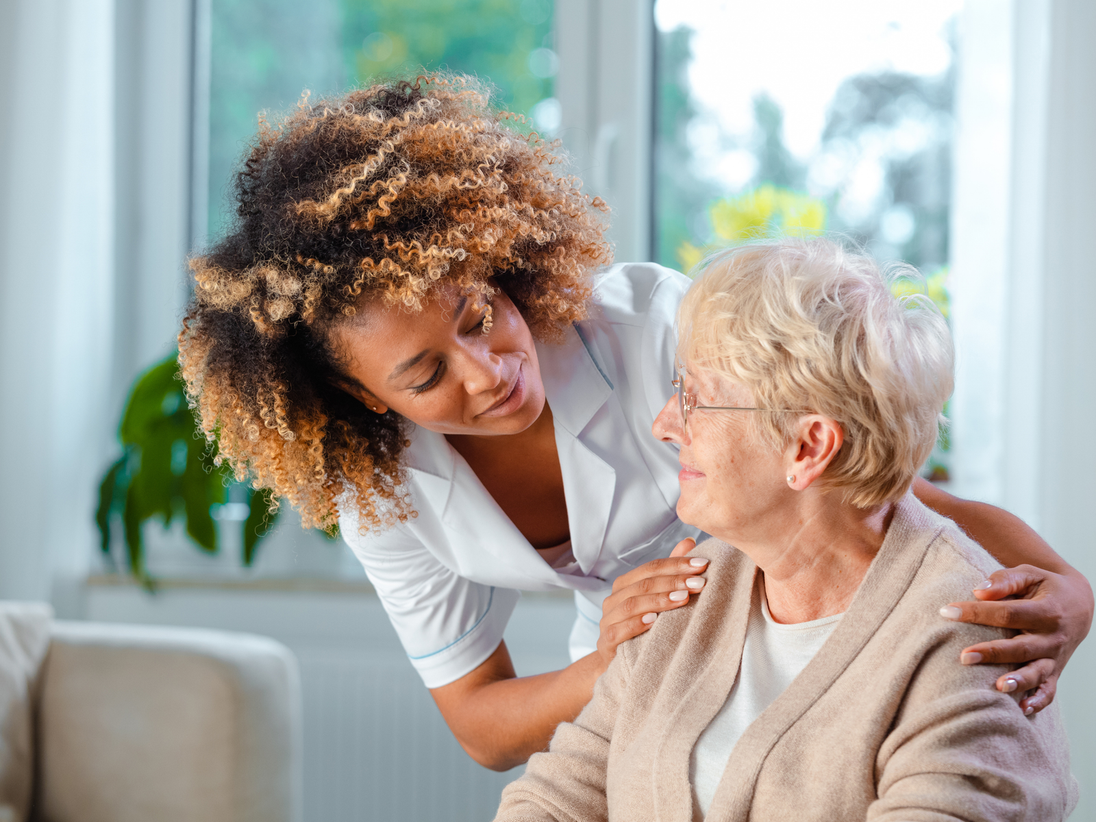 Care management professional coordinating with a family at home