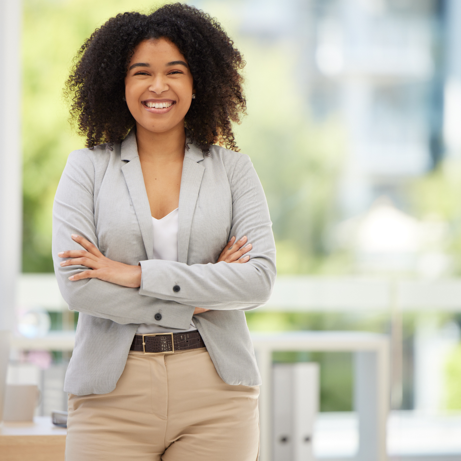 Professional care manager smiling in a bright office